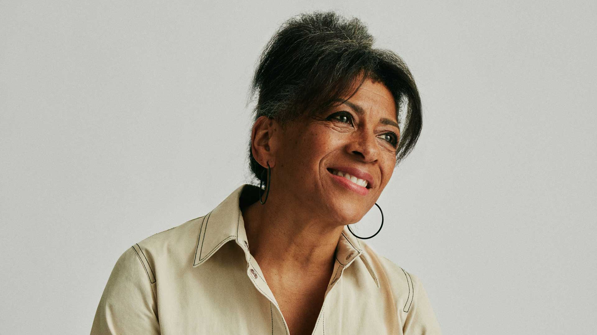 Middle-aged black woman smiling, side profile