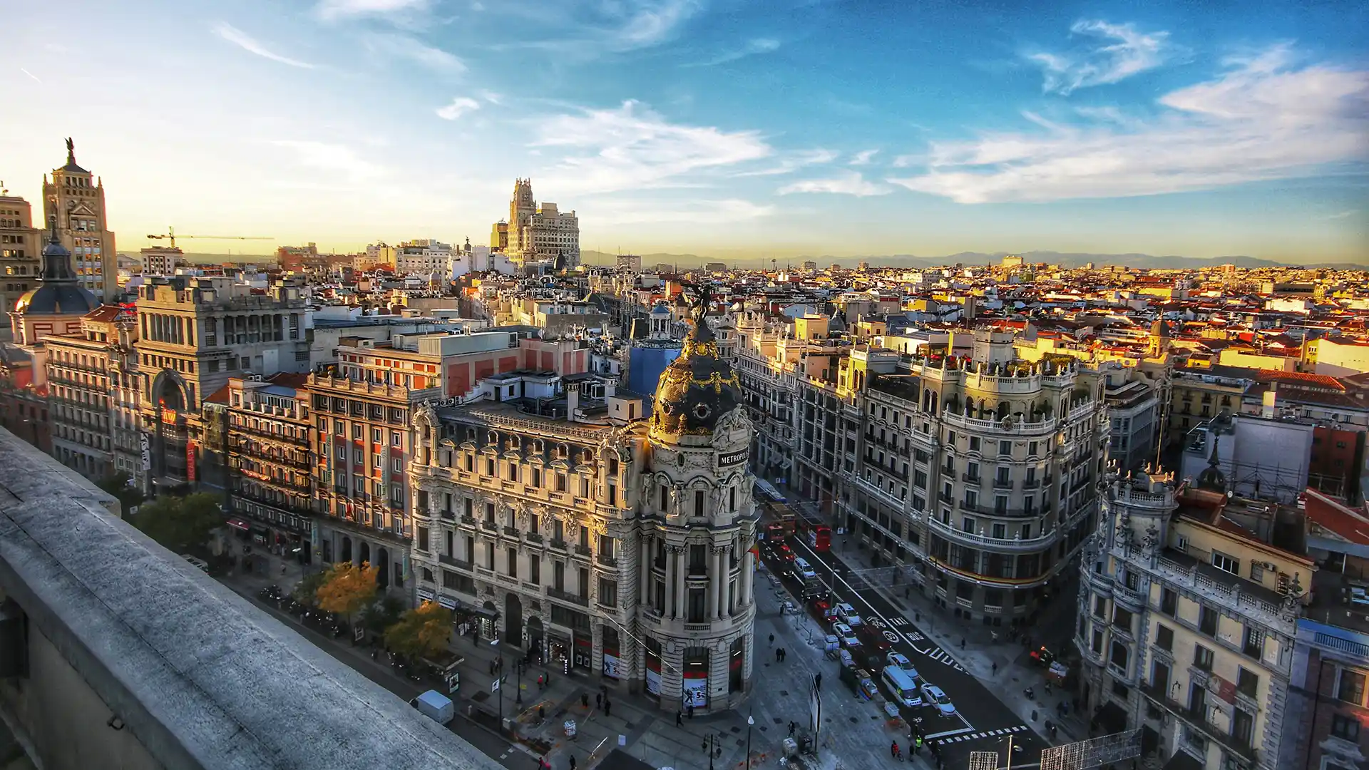 View of a Spanish city taken from a balcony at dusk